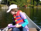 One of our guests canoeing and fishing on lake duncan.